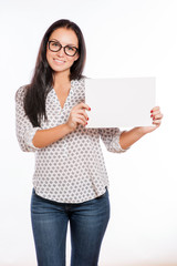 Portrait of cheerful beautiful woman showing blank signboard wit