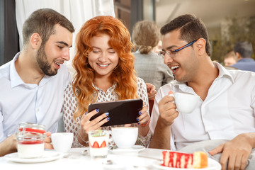 Cheerful business partners on coffee break