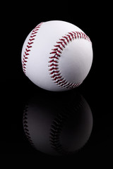 Baseball on black background
