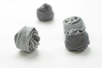 Clean laundered men's socks on a white background