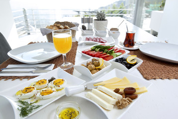 Rich and delicious Turkish breakfast on white wood table