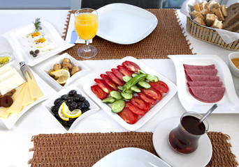 Rich and delicious Turkish breakfast on white wood table