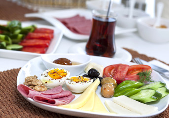 Rich and delicious Turkish breakfast on white wood table