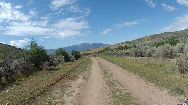 Driving ATV along mountain dirt road fast timelapse HD 016