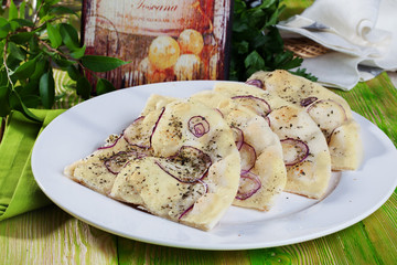 Italian focaccia with purple onions and Provence herbs in a