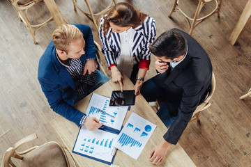 Small group of business people at a meeting in a cafe
