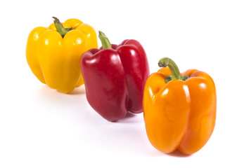 Multicolor sweet peppers isolated on white