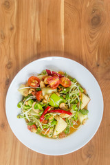 sunflower sprout salad with tomato and apple ,clean food on wood table