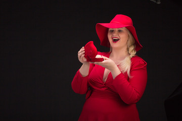 Sexy plus size woman in red hat with red lips.