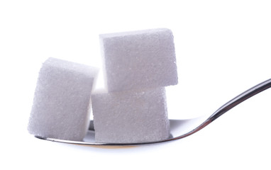 Obraz premium White sugar cubes on a spoon