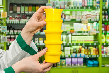 Female Pharmacists Hand Holding Few Bottle