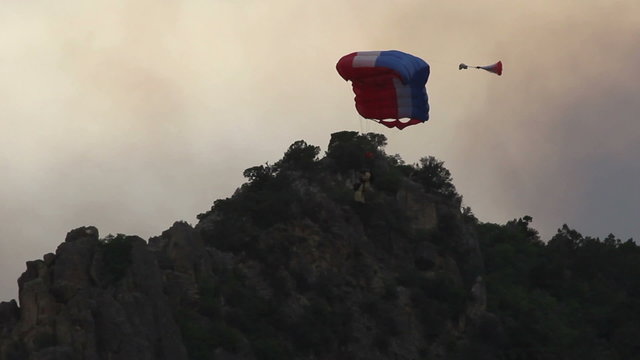 Fireman smoke jumper parachute into forest fire P HD 0058