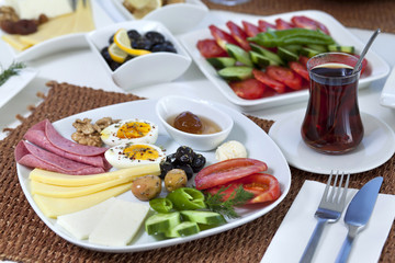 Rich and delicious Turkish breakfast on white wood table