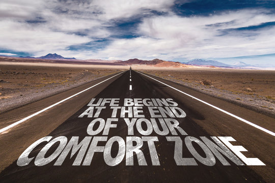 Life Begins at the End of your Comfort Zone written on desert road
