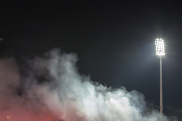 stadium lights and smoke