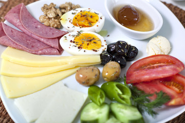Rich and delicious Turkish breakfast on white wood table
