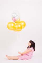 kid and balloons