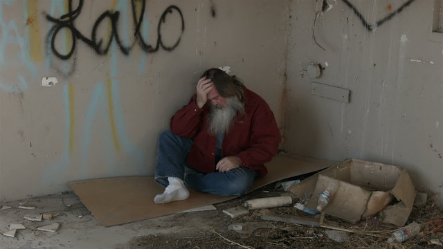 Abandoned building headache homeless man in corner HD 1548