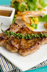 grilled t-bone steak and vegetables