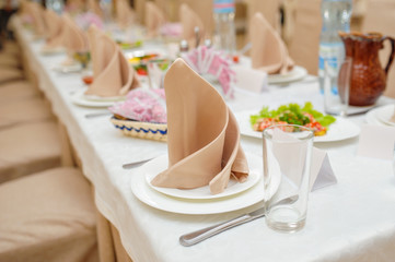 beautifully decorated table for a wedding party in a restaurant