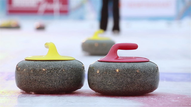 The stones for Curling on the ice.