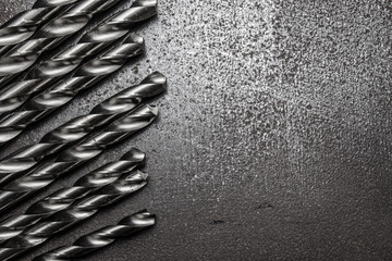 Metal drill bits on metal plate