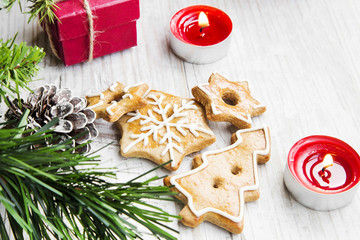 Christmas Gingerbread Cookies with Ornaments on Wooden Board