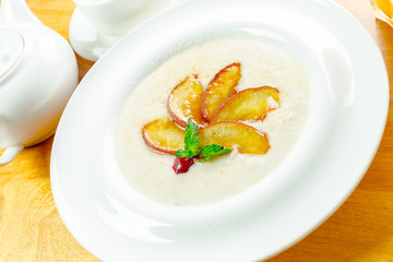 Trendy porridge decorated with fruits
