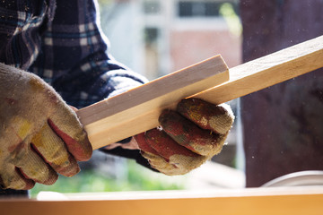 Carpenter working with wood, close up photo