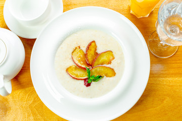 Trendy porridge decorated with fruits