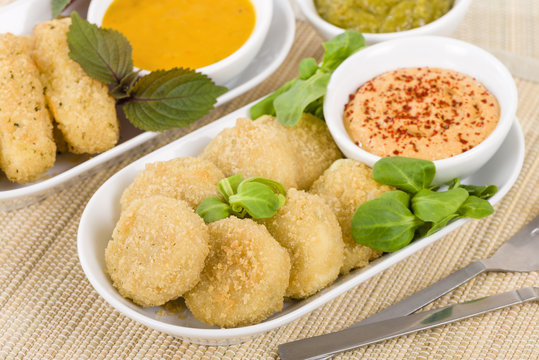 Deep Fried Cheese - Breaded and deep fried cheese served with dipping sauce.
