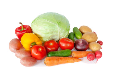 Composition with raw vegetables on white