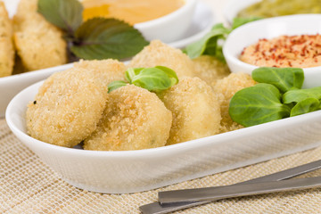 Deep Fried Cheese - Breaded and deep fried cheese served with dipping sauce.
