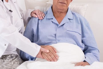 Consoling old and ill patient © Photographee.eu