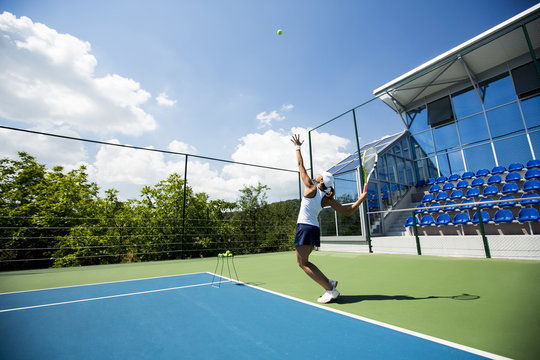 Young Woman Playing Tennis