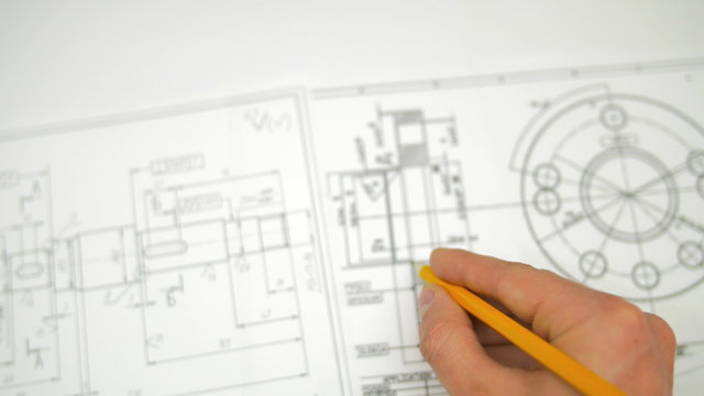 The hand keep pencil and work with blueprint engineering project