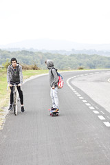 child with skateboard outdoors