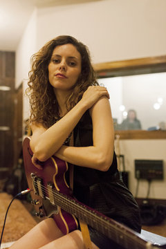 Portrait of a young female guitarist
