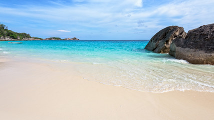 Beautiful landscape of blue sky sea sand and white waves on the beach during summer at Koh Miang island in Mu Ko Similan National Park, Phang Nga province, Thailand, 16:9 widescreen
