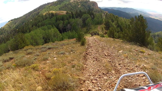 Recreation vehicle RZR drive down high mountain trail HD 0002