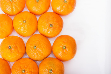 Ripe tangerines closeup isolated on white background