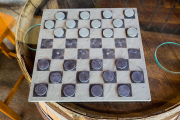 Checkers Game on Wine Barrel Table