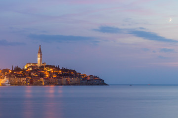 Fototapeta premium Beautiful romantic old town of Rovinj after magical sunset and moon on the sky,Istrian Peninsula,Croatia,Europe