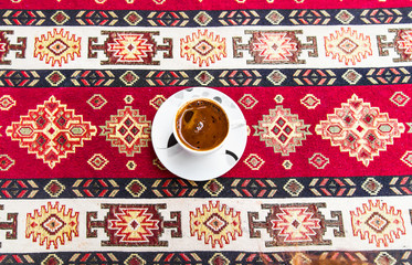 cup of coffee on the traditional turkish tablecloth 