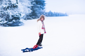 Fototapeta na wymiar Happy child playing in snow