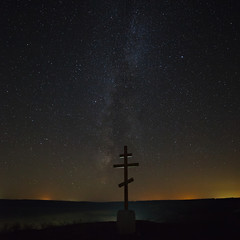 The cross on the background of the Milky Way in the night sky.