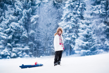 Happy child playing in snow