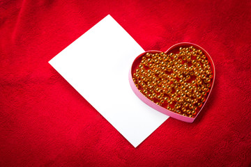 heart with a blank card on red background