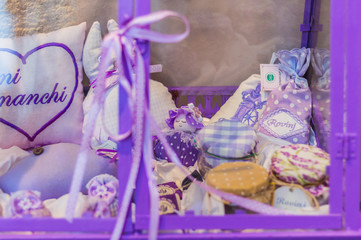 closeup of lavender soap and scented sachets with fresh flowers