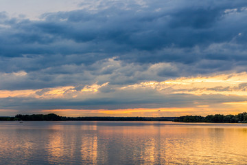 Sunset with dramatic sky over Nove Mlyny lake, Mikulov, Czech Republic